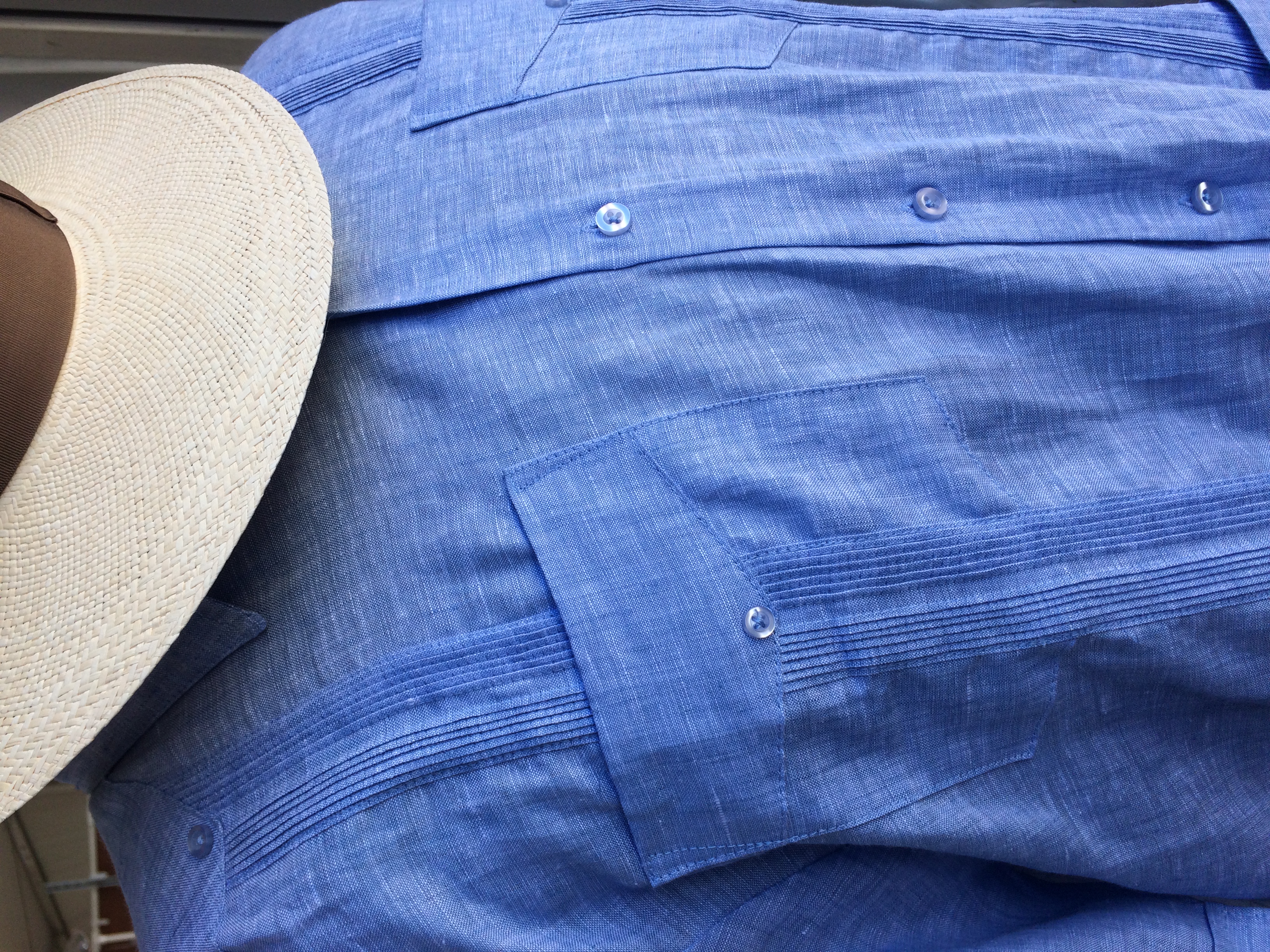 Guayabera and hat